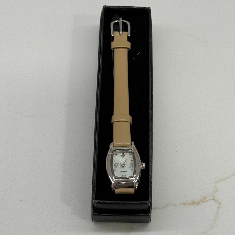 Avon 2009 Diamond accent watch with MOP dial taupe